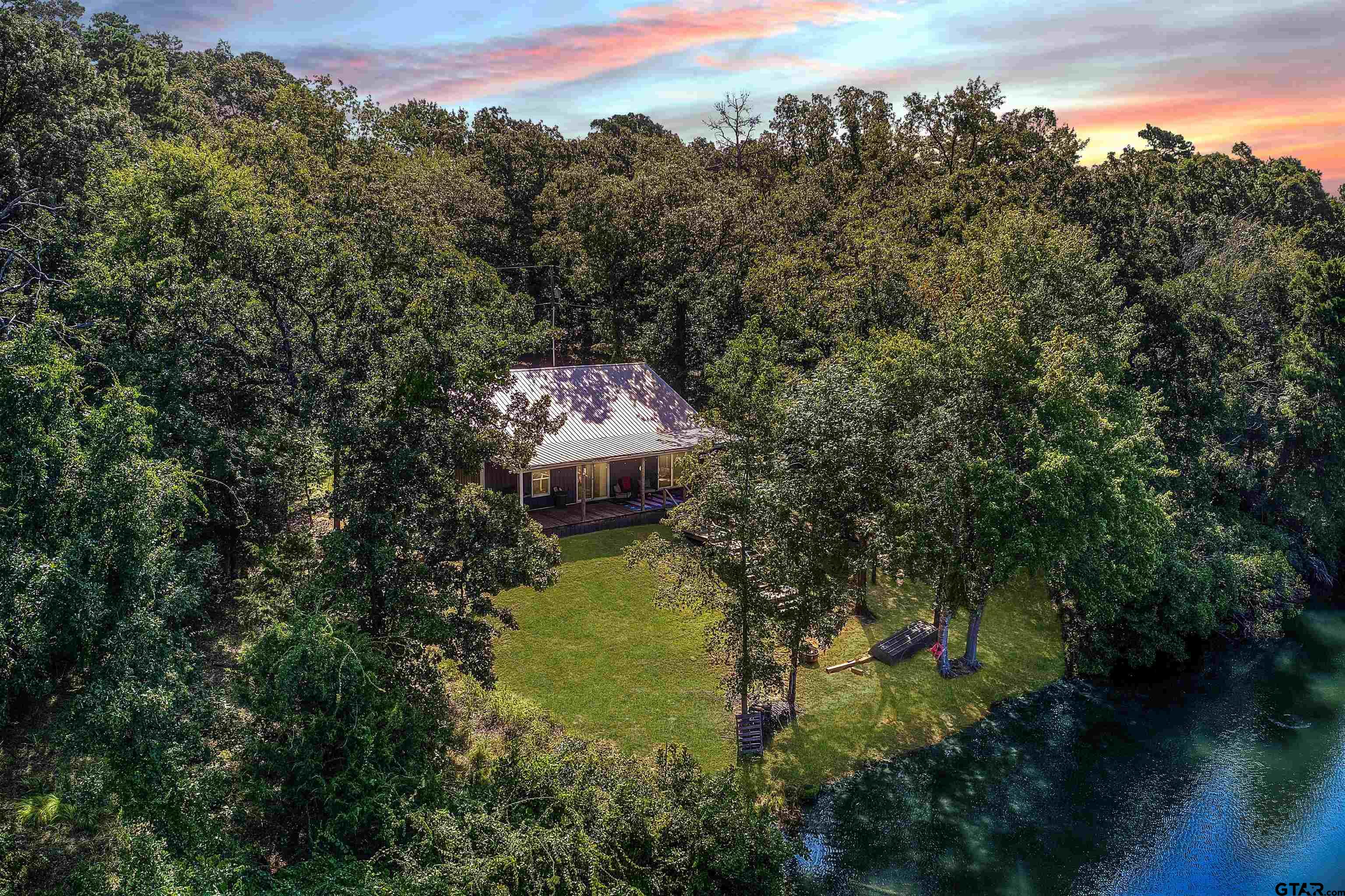 132 King George Road Scroggins, TX 75480 - Photo 35 of 35 a aerial view of a house with a yard basket ball court and outdoor seating