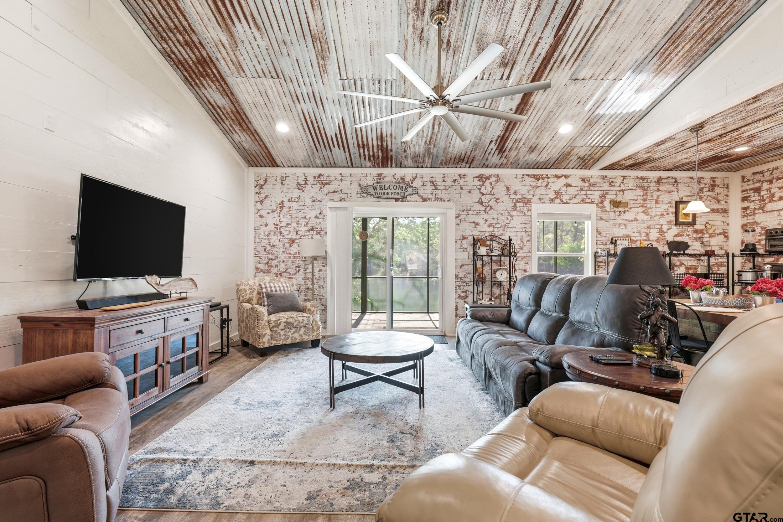 132 King George Road Scroggins, TX 75480 - Photo 5 of 35 a living room with furniture and a flat screen tv