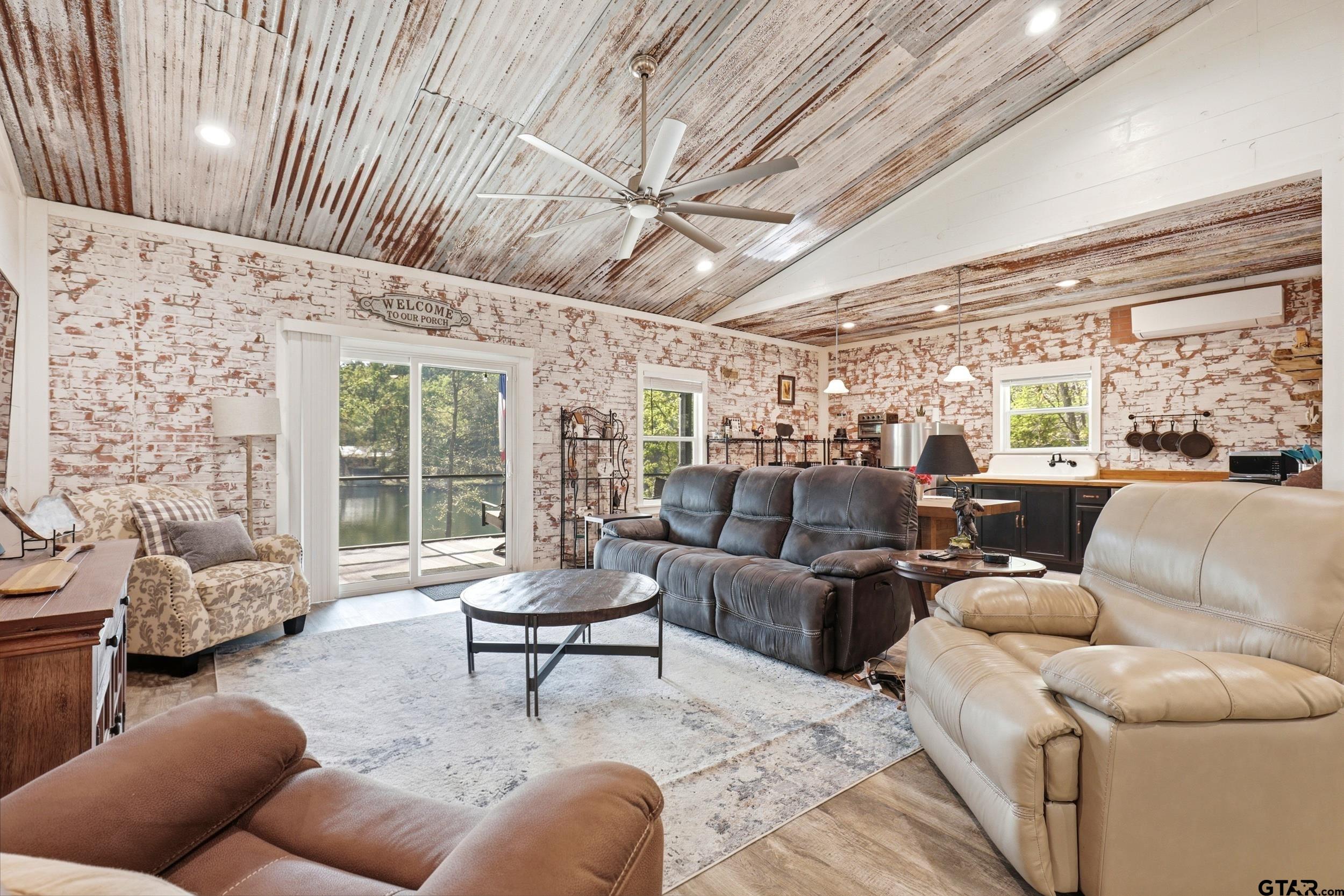 132 King George Road Scroggins, TX 75480 - Photo 6 of 35 a living room with furniture and a large window
