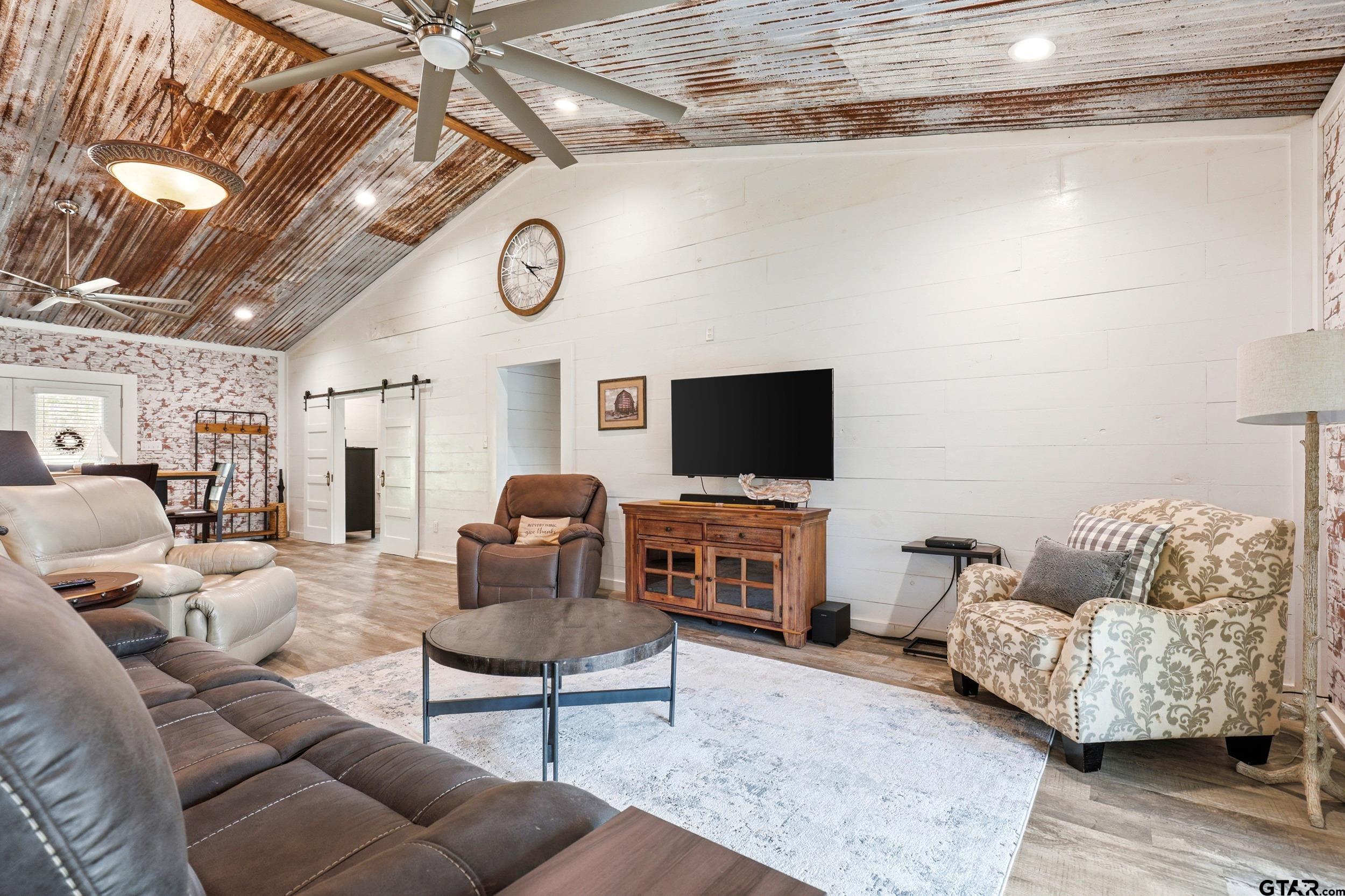 132 King George Road Scroggins, TX 75480 - Photo 7 of 35 a living room with furniture and a flat screen tv