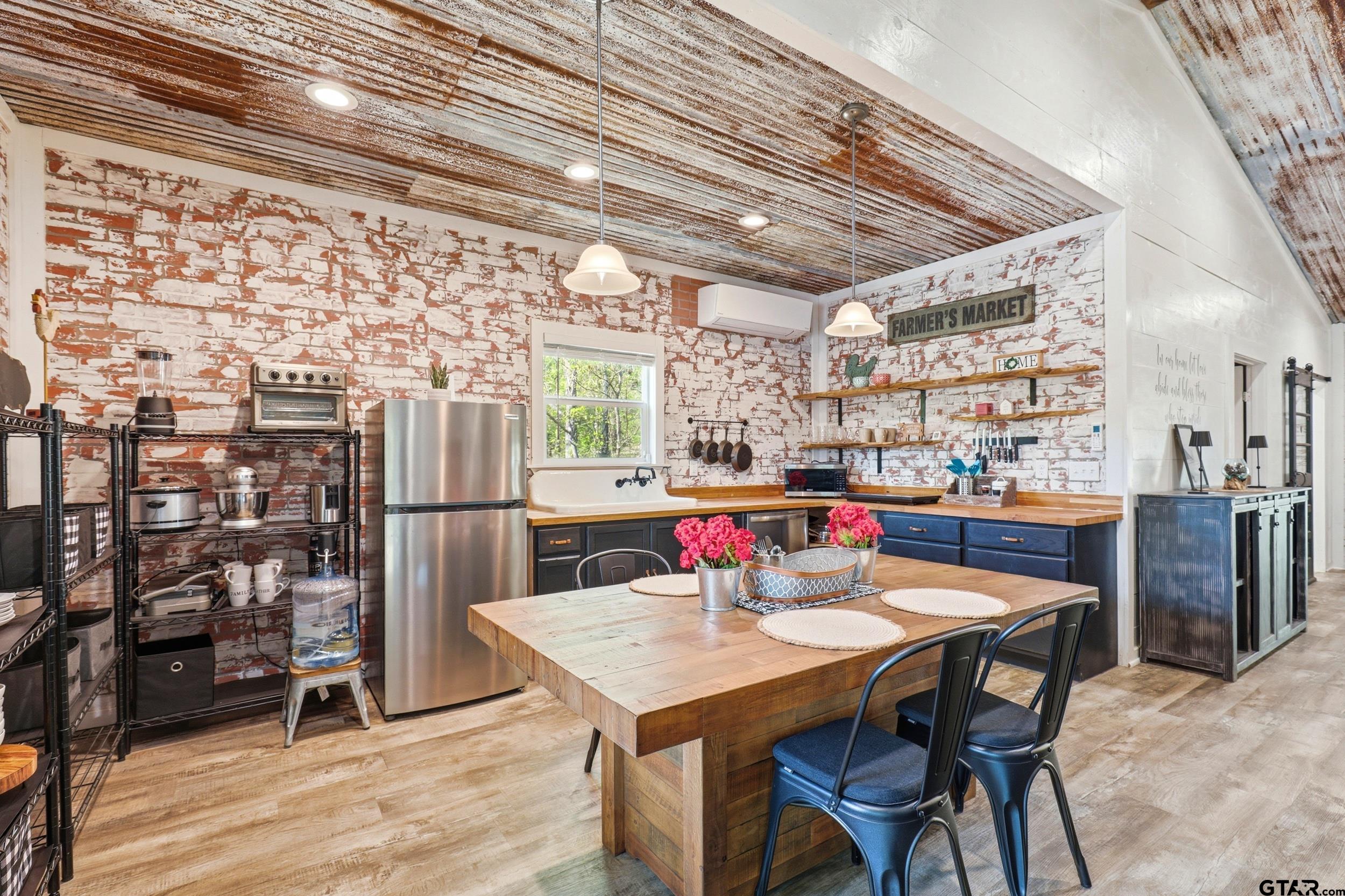 132 King George Road Scroggins, TX 75480 - Photo 9 of 35 a view of a dining room with furniture and wooden floor