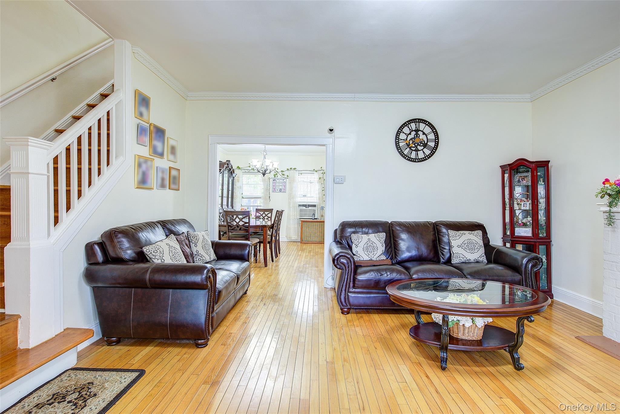161-10 84th Road Queens, NY 11432 - Photo 11 of 44 a living room with furniture and a wooden floor