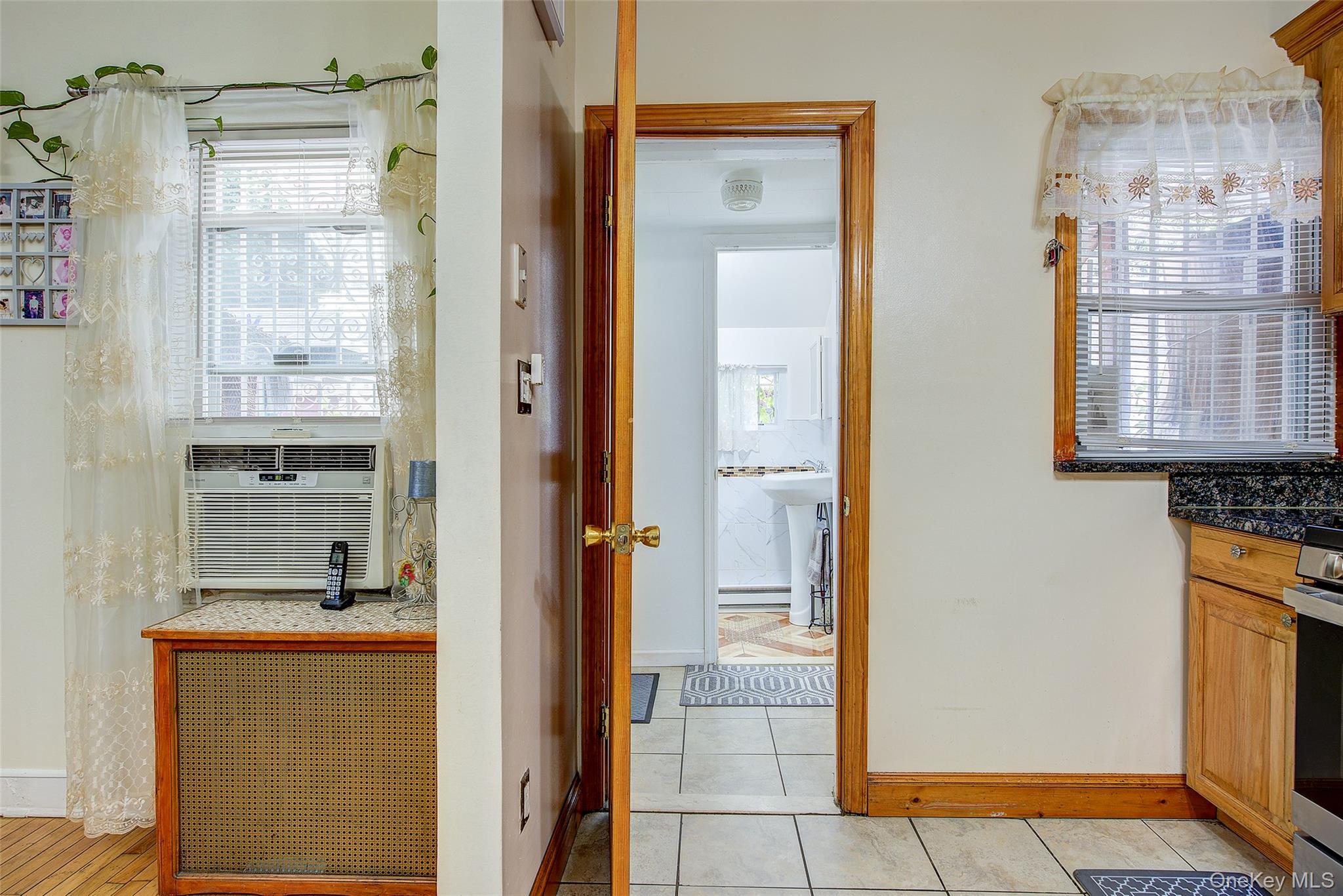 161-10 84th Road Queens, NY 11432 - Photo 19 of 44 a bathroom with a shower and a sink
