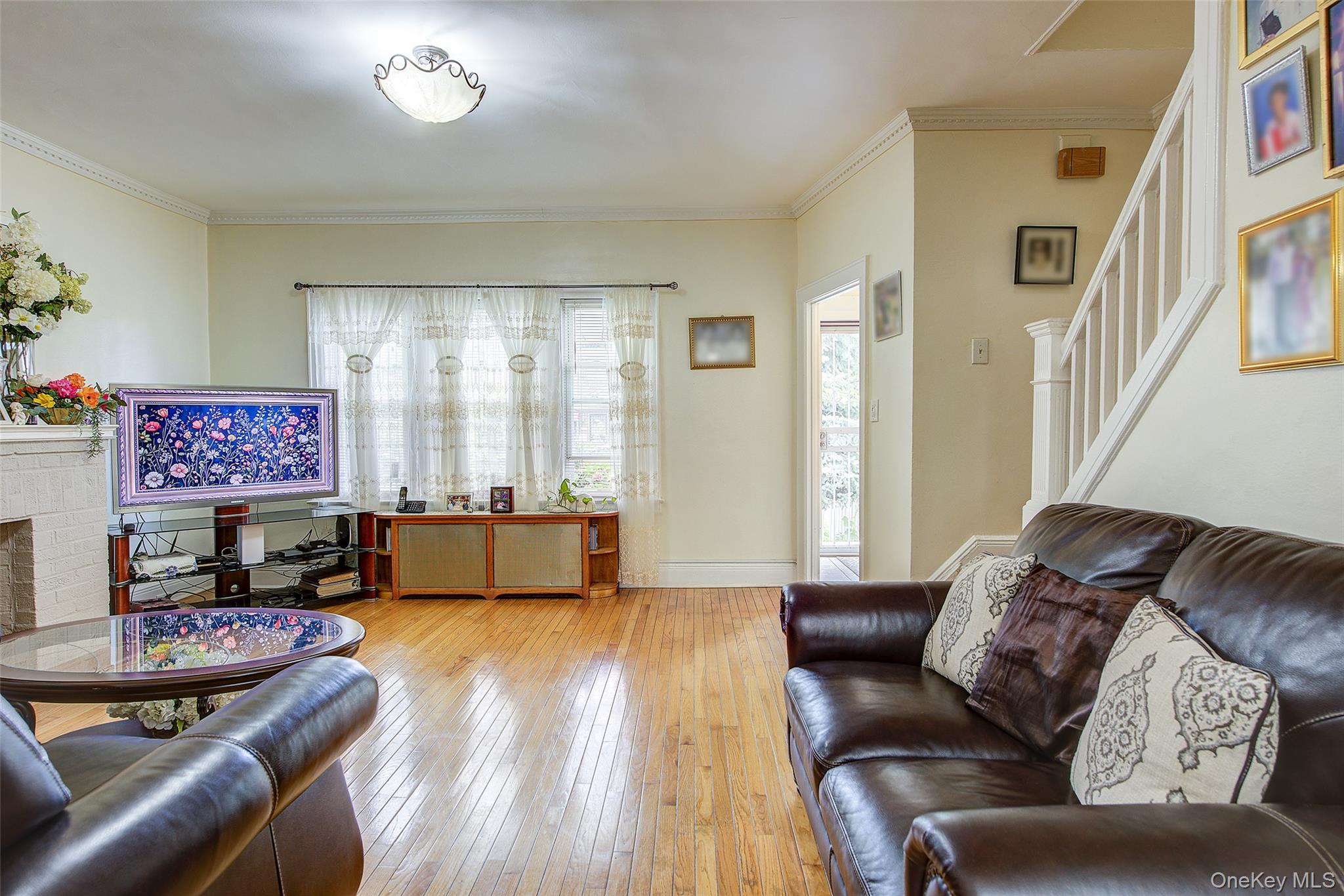 161-10 84th Road Queens, NY 11432 - Photo 22 of 44 a living room with furniture and a large window