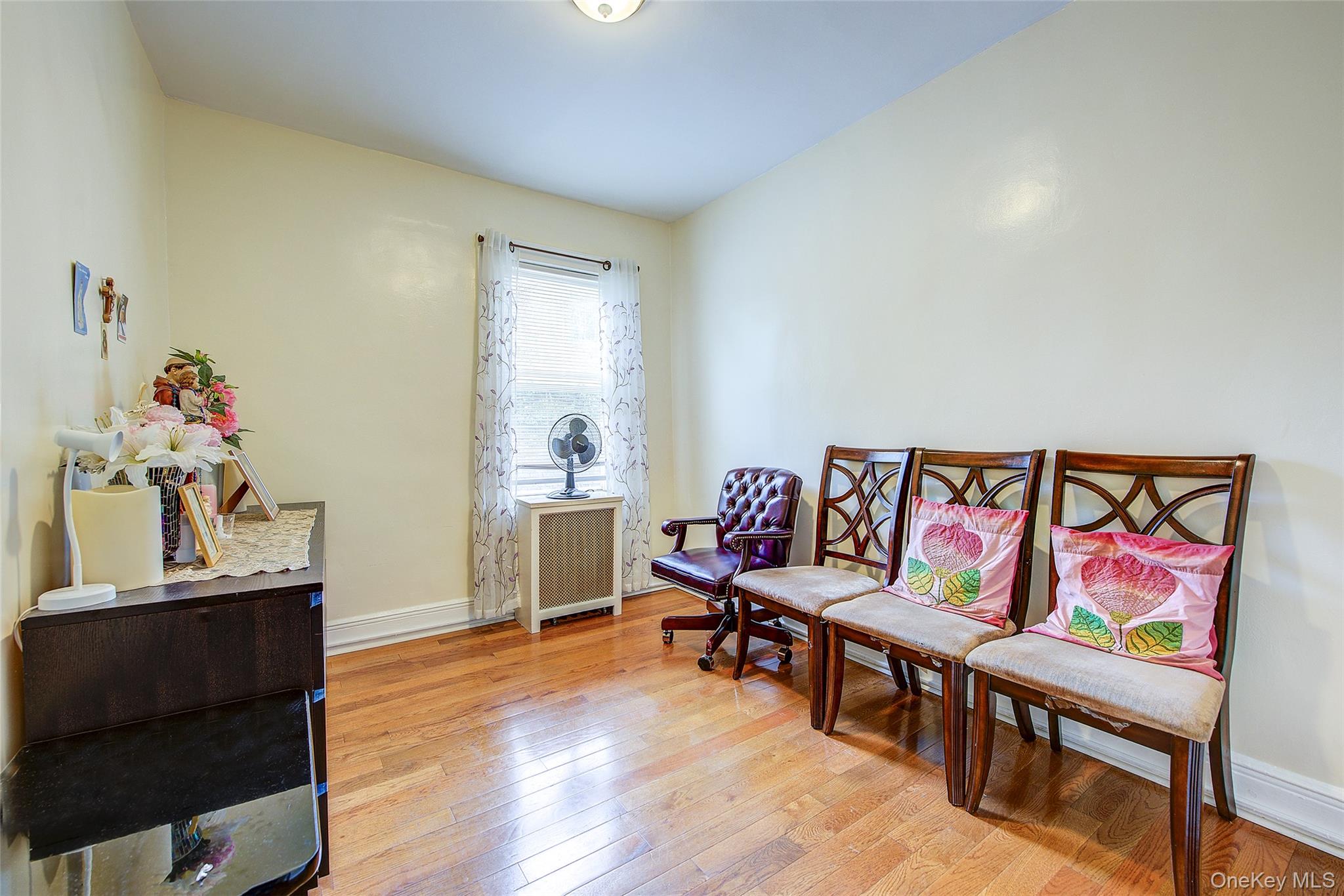 161-10 84th Road Queens, NY 11432 - Photo 31 of 44 a living room with furniture and wooden floor