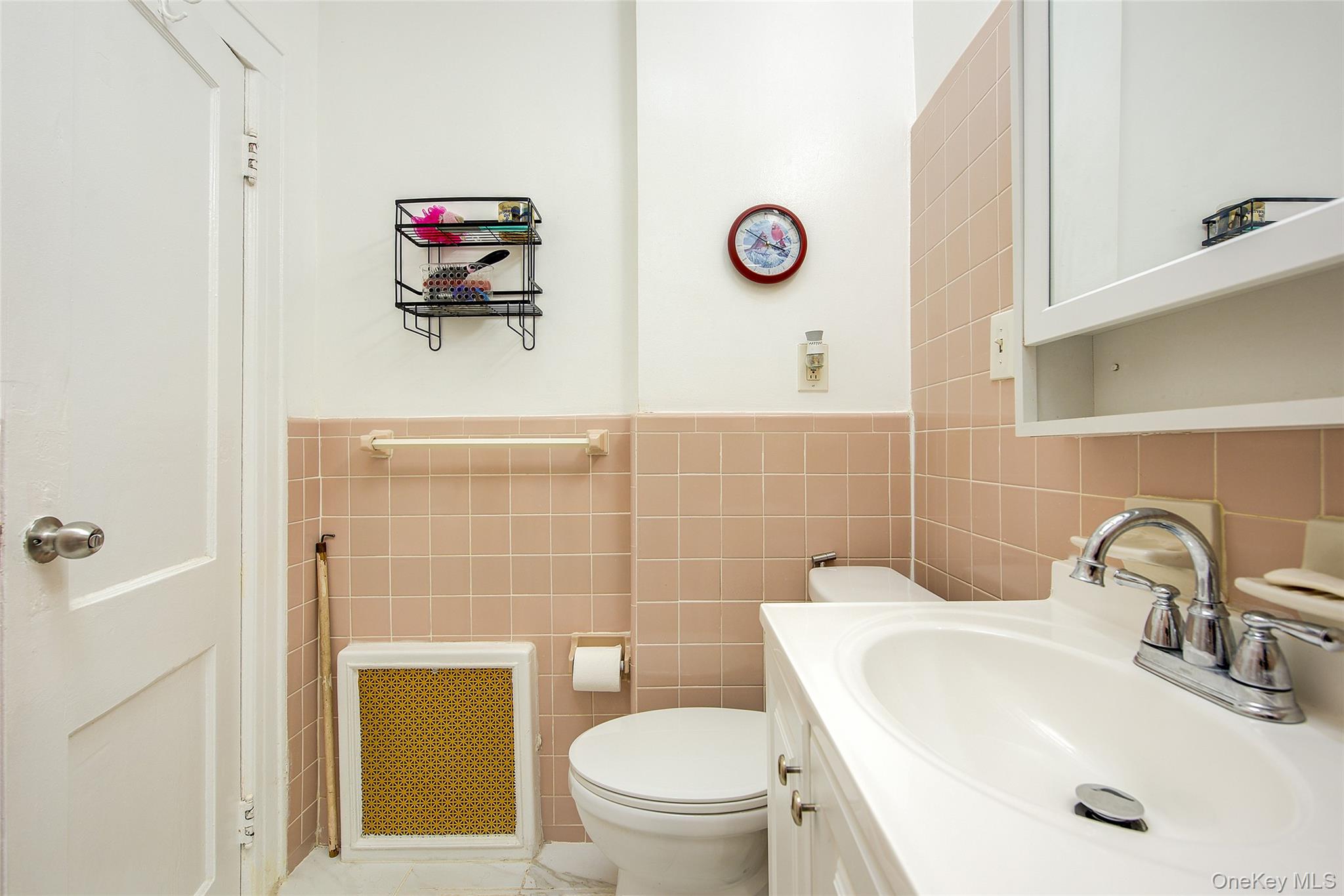 161-10 84th Road Queens, NY 11432 - Photo 35 of 44 a bathroom with a sink and a toilet