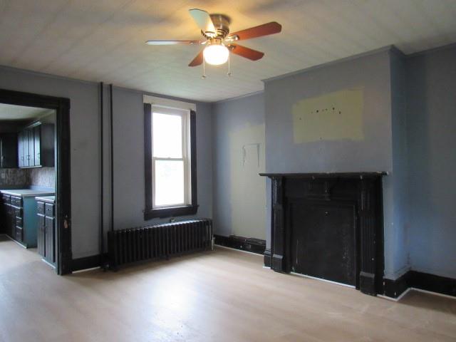 103 Memorial Street Dunbar, PA 15431 - Photo 7 of 18 an empty room with windows and fan