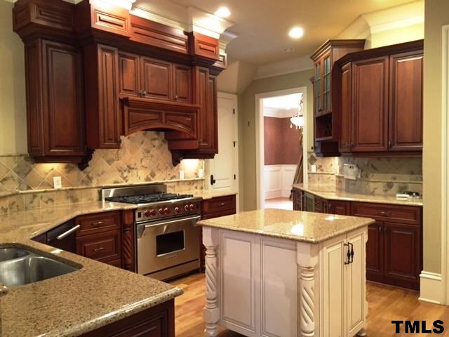 105 Winding Ridge Road Durham, NC 27713 - Photo 2 of 5 a kitchen that has a sink and a stove