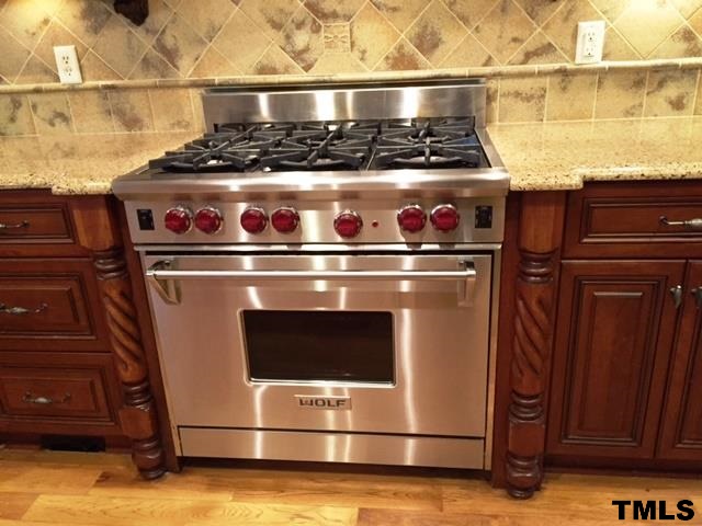 105 Winding Ridge Road Durham, NC 27713 - Photo 3 of 5 a stove top oven sitting inside of a kitchen