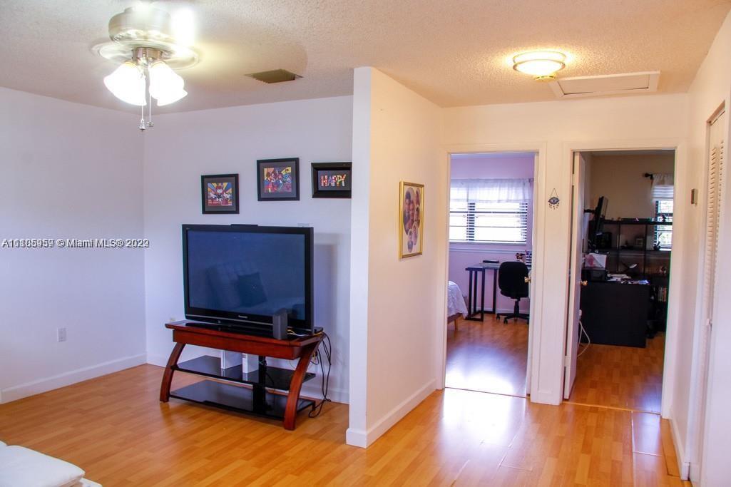 10000 Southwest 147th Court Miami, FL 33196 - Photo 15 of 36 a living room with furniture and a table