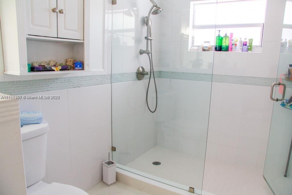 10000 Southwest 147th Court Miami, FL 33196 - Photo 24 of 36 a bathroom with a shower