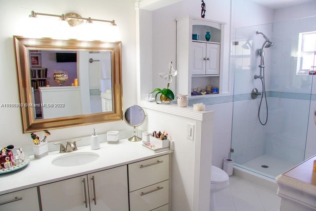 10000 Southwest 147th Court Miami, FL 33196 - Photo 25 of 36 a bathroom with a sink toilet and shower