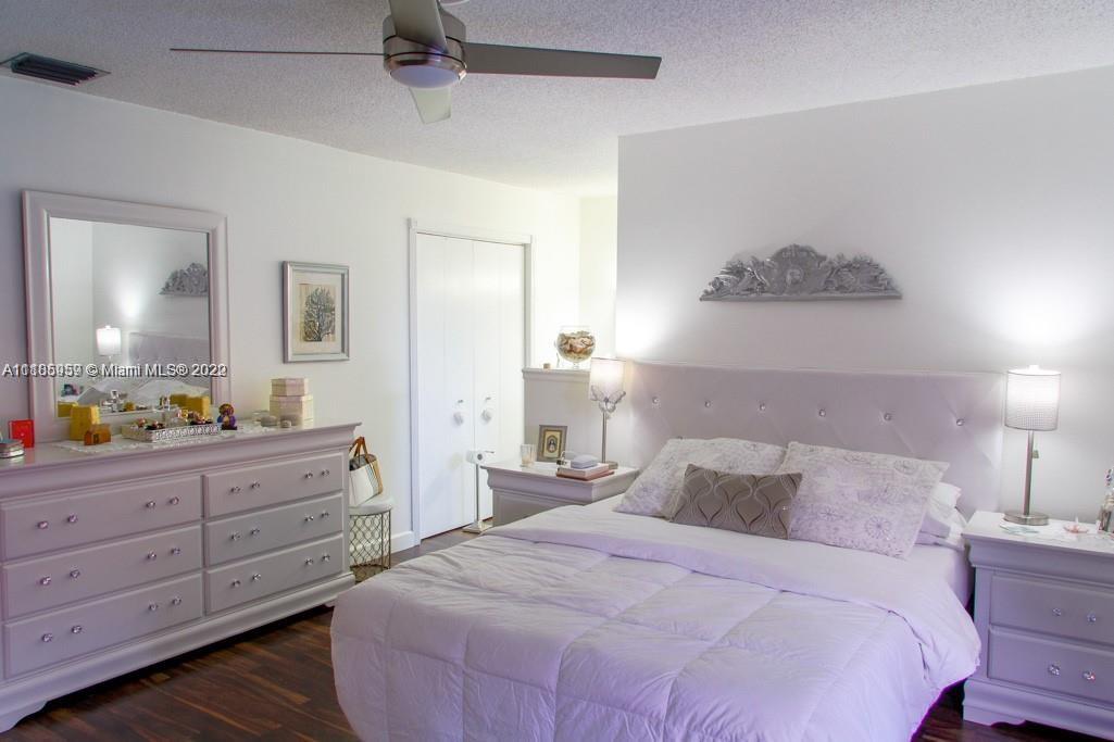 10000 Southwest 147th Court Miami, FL 33196 - Photo 26 of 36 a bedroom with a bed and a dresser