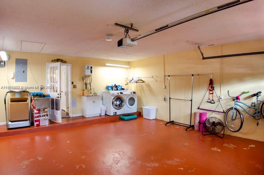 10000 Southwest 147th Court Miami, FL 33196 - Photo 28 of 36 a view of a room with gym equipment