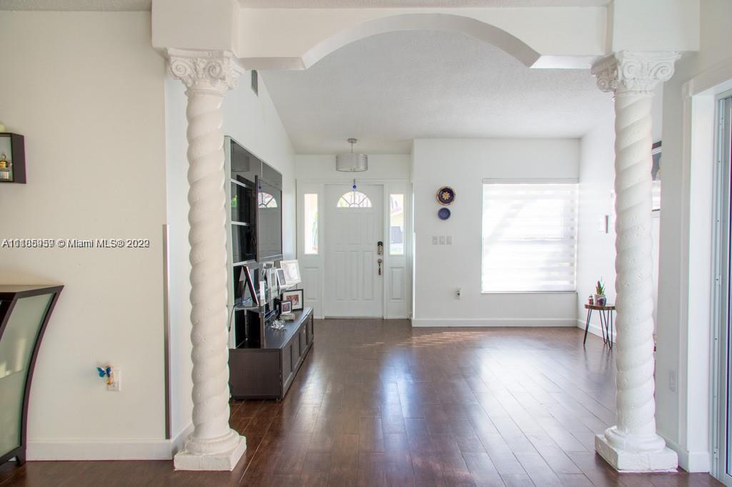 10000 Southwest 147th Court Miami, FL 33196 - Photo 3 of 36 a view of an entryway with wooden floor