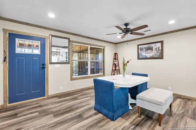 a view of a dining room with furniture window and wooden floor
