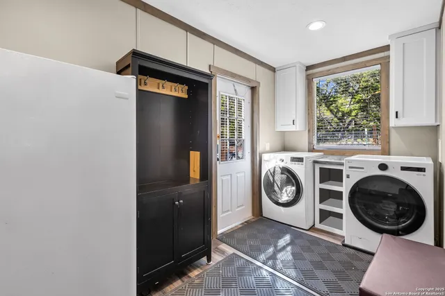 a view of washer and dryer in a utility room