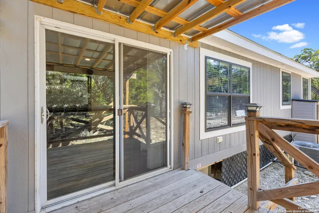 a view of a walk in closet and balcony