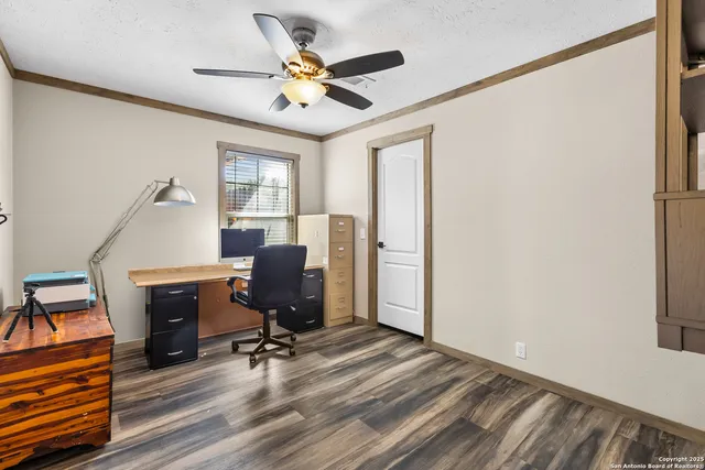 a view of workspace with wooden floor windows