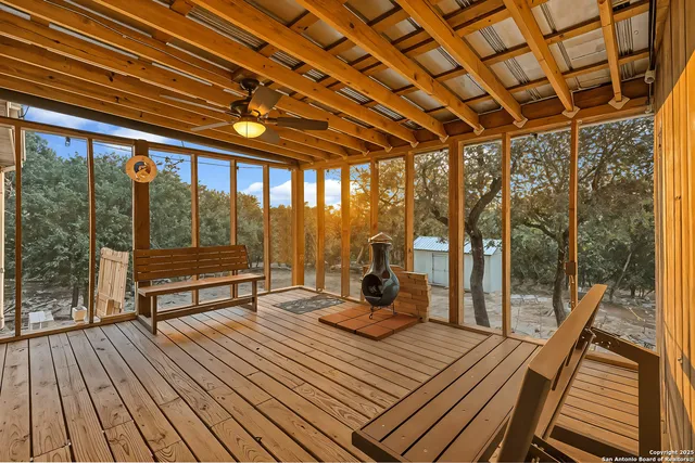 a view of a balcony with wooden floor