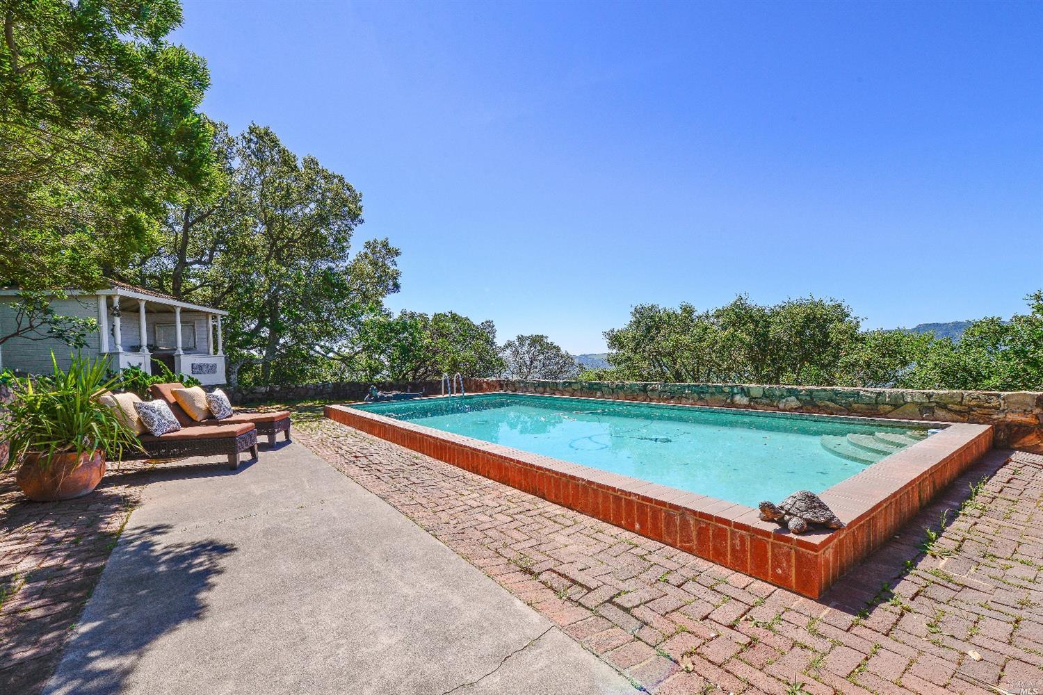 17797 High Road Sonoma, CA 95476 - Photo 1 of 1 a view of a swimming pool with a lounge chairs