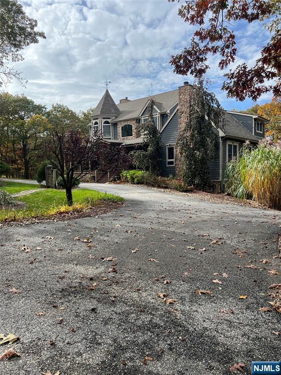 12 Breakneck Road Vernon, NJ 07462 - Photo 12 of 17 a front view of a house with a yard and garage