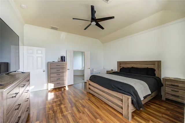 a bedroom with a bed and a dresser