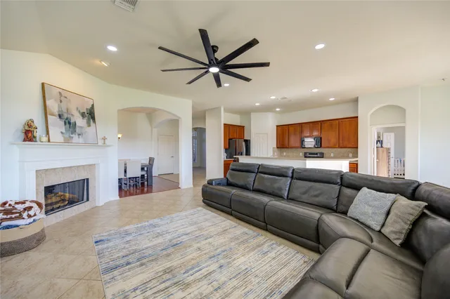 a view of a livingroom with furniture and a fireplace