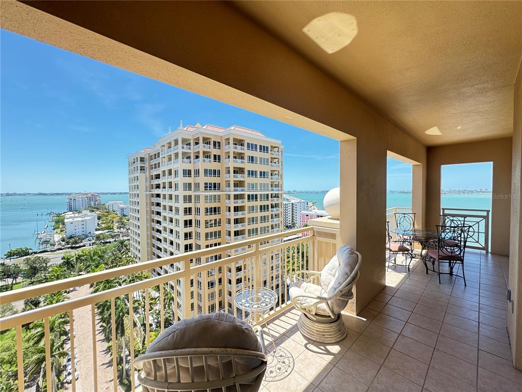 1111 Ritz Carlton Drive, Unit 1404 Sarasota, FL 34236 - Photo 18 of 69 a view of a balcony with chairs