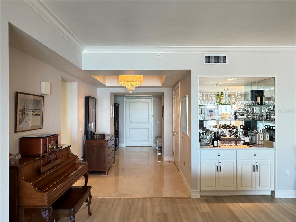 1111 Ritz Carlton Drive, Unit 1404 Sarasota, FL 34236 - Photo 3 of 69 a living room with furniture and wooden floor