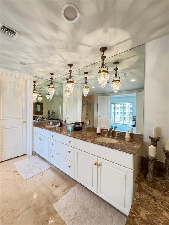 1111 Ritz Carlton Drive, Unit 1404 Sarasota, FL 34236 - Photo 31 of 69 a bathroom with a granite countertop sink mirror and