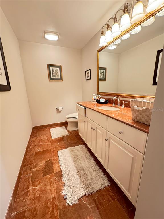 1111 Ritz Carlton Drive, Unit 1404 Sarasota, FL 34236 - Photo 39 of 69 a bathroom with a sink and mirror