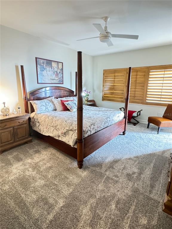 1111 Ritz Carlton Drive, Unit 1404 Sarasota, FL 34236 - Photo 41 of 69 a bed room with a bed and a couch