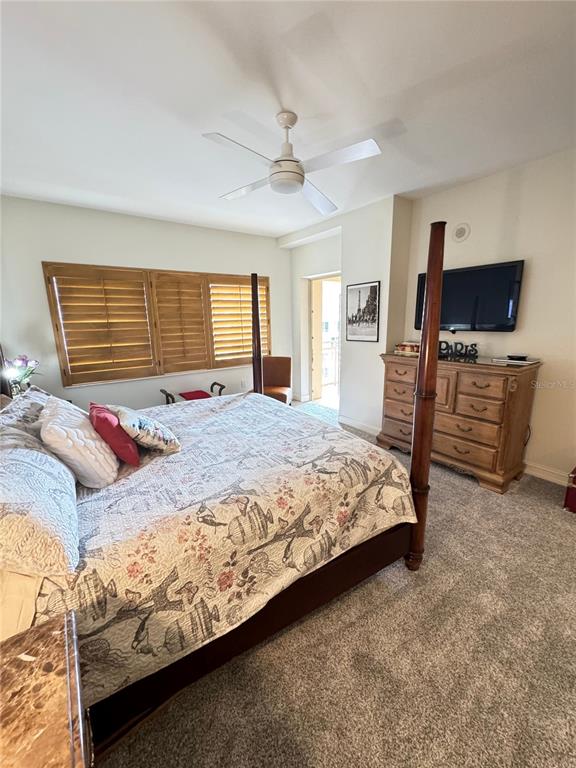 1111 Ritz Carlton Drive, Unit 1404 Sarasota, FL 34236 - Photo 42 of 69 a bedroom with a bed and flat screen tv