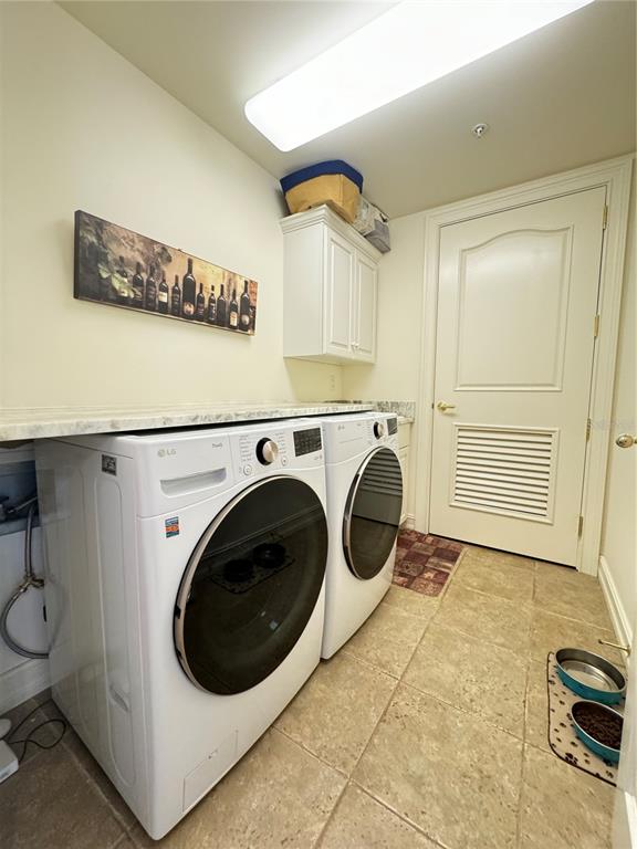 1111 Ritz Carlton Drive, Unit 1404 Sarasota, FL 34236 - Photo 46 of 69 a utility room with dryer and washer