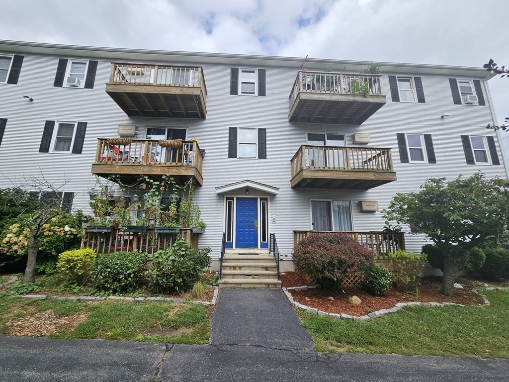 434 Linden Street, Unit 4 Fall River, MA 02720 - Photo 1 of 25 a front view of residential houses with yard