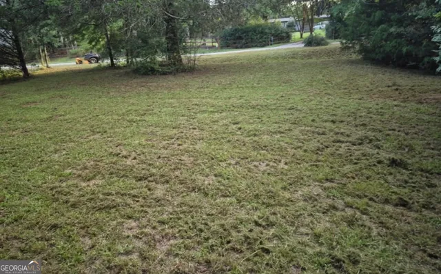 a view of outdoor space with deck and yard