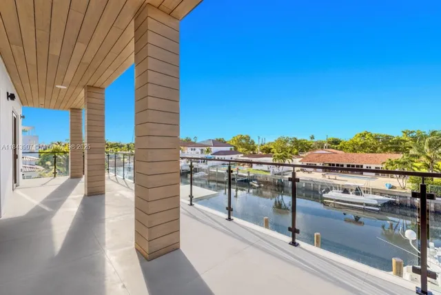 a view of a balcony with two chairs