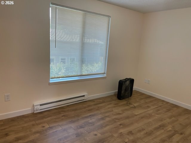 8856 Southeast Jannsen Road Clackamas, OR 97015 - Photo 13 of 28 a room with a window and a wooden floor