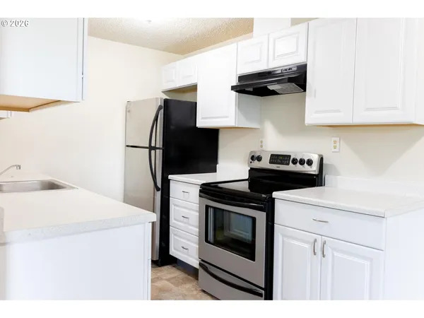 a view of a kitchen with a sink