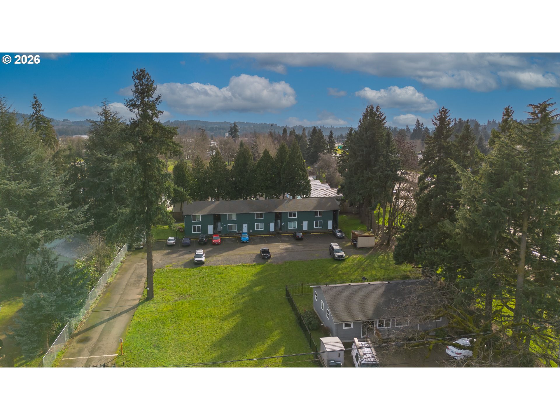 8856 Southeast Jannsen Road Clackamas, OR 97015 - Photo 2 of 28 a balcony with furniture and a garden