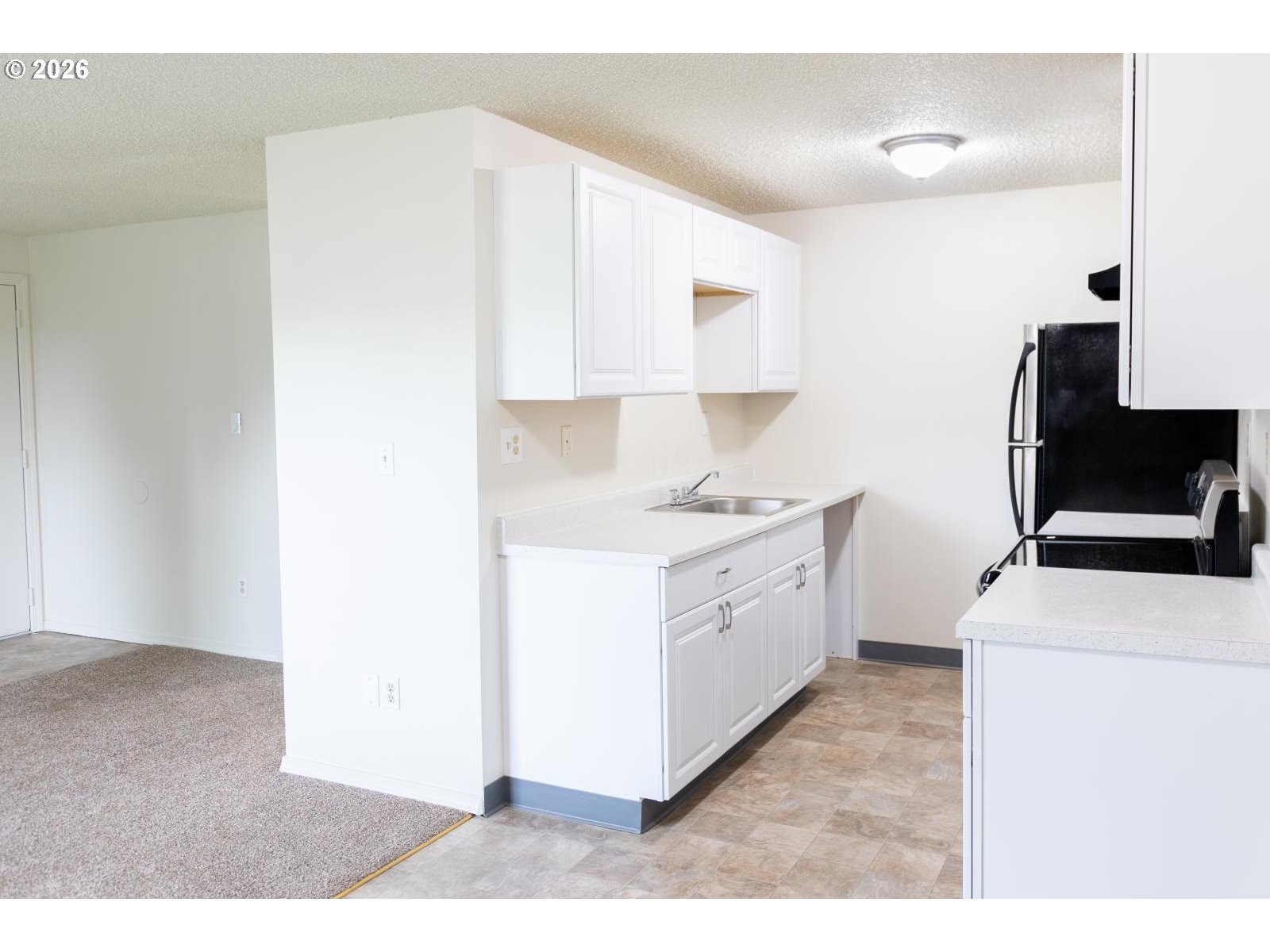 8856 Southeast Jannsen Road Clackamas, OR 97015 - Photo 25 of 28 a kitchen with a sink cabinets and appliances