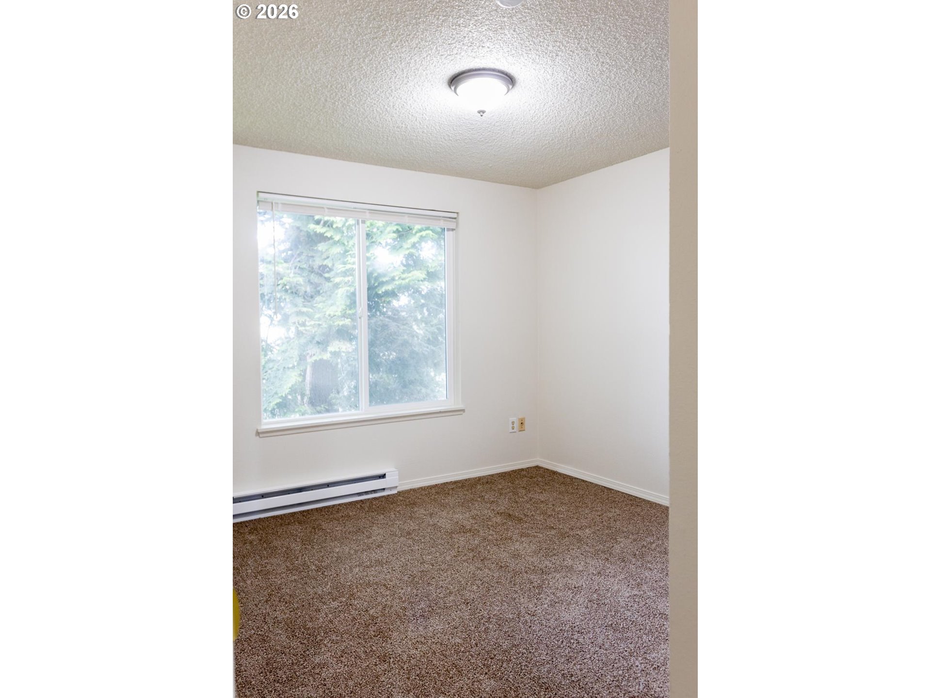 8856 Southeast Jannsen Road Clackamas, OR 97015 - Photo 27 of 28 a view of an empty room with a window