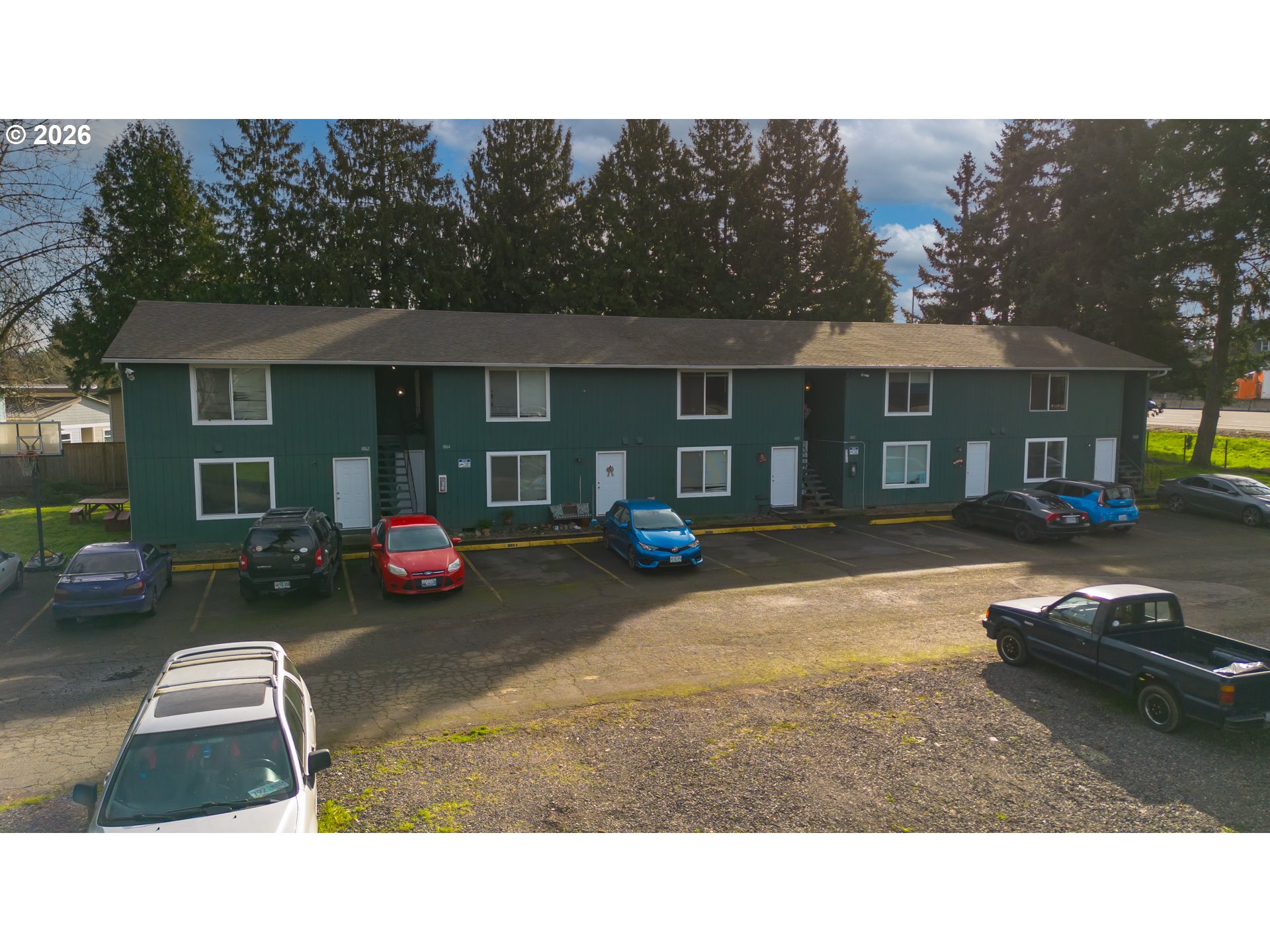 8856 Southeast Jannsen Road Clackamas, OR 97015 - Photo 6 of 28 a backyard of a house with yard fire pit and outdoor seating