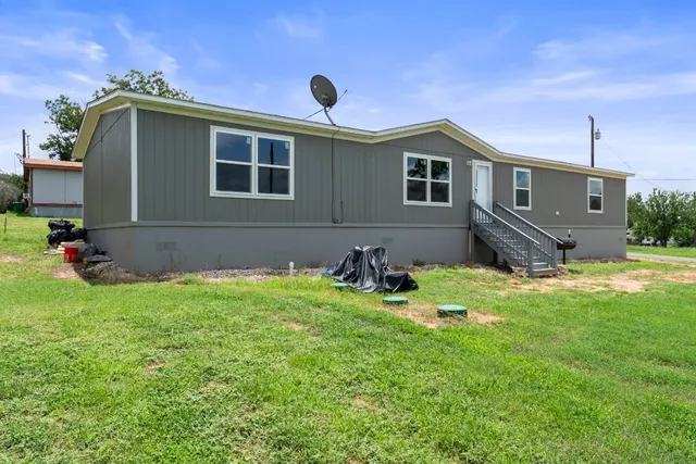 a house view with a garden space