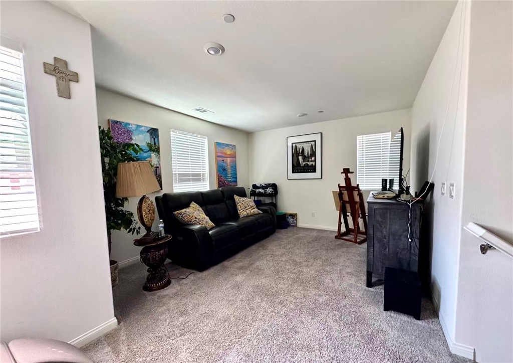 10664 Busch Street Spring Valley, CA 91978 - Photo 7 of 14 a living room with furniture and a window