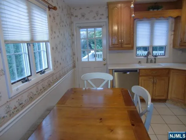 a kitchen with a sink cabinets and window