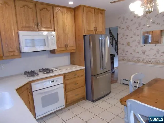 a view of a dresser and mirror in a room