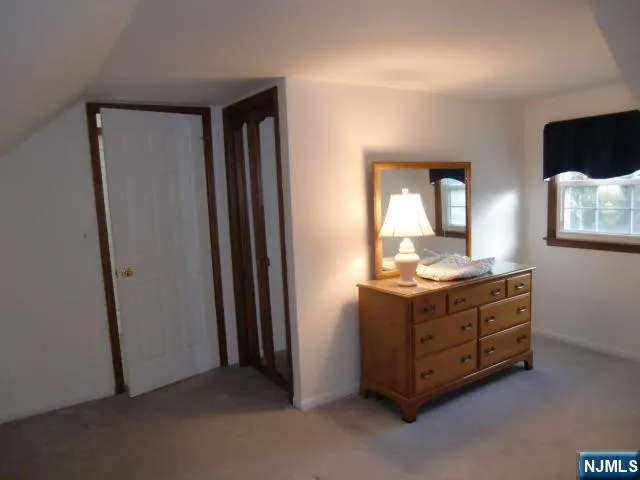 a view of cabinet and chair in a room