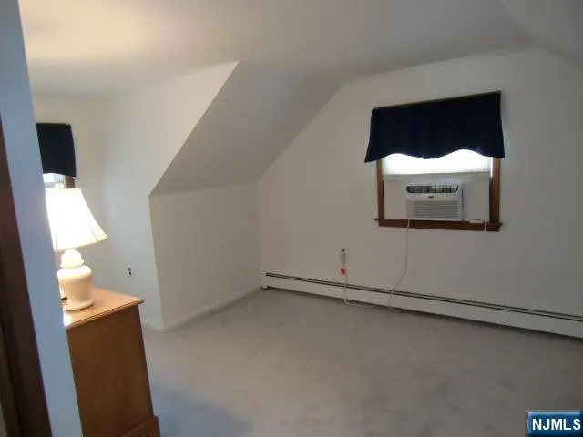 a room with furniture and a flat screen tv